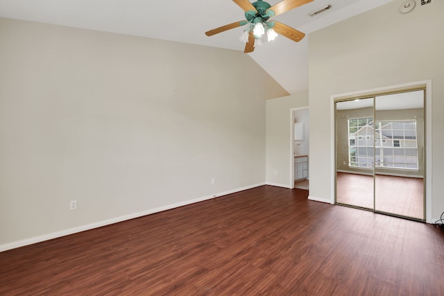360 Holiday Ln, Coldspring, TX 77331 - empty room with dark wood-style flooring, ceiling fan, baseboards, and high vaulted ceiling
