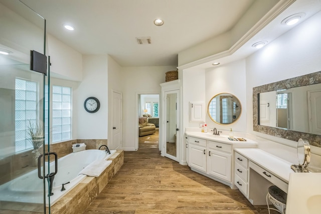 17407 W Blooming Rose Ct, Cypress, TX 77429 - full bath with a garden tub, vanity, recessed lighting, wood finished floors, and a shower with door