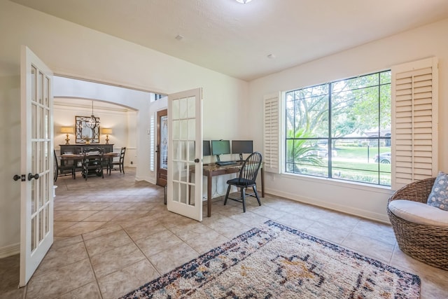17407 W Blooming Rose Ct, Cypress, TX 77429 - office area with french doors, plenty of natural light, arched walkways, and tile patterned flooring