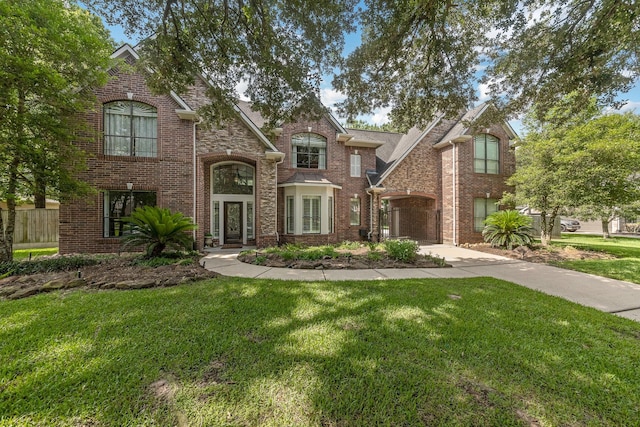 17407 W Blooming Rose Ct, Cypress, TX 77429 - view of front of house with a front lawn and brick siding