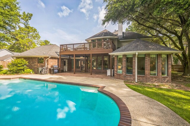 17407 W Blooming Rose Ct, Cypress, TX 77429 - outdoor pool featuring a patio area, area for grilling, and a deck