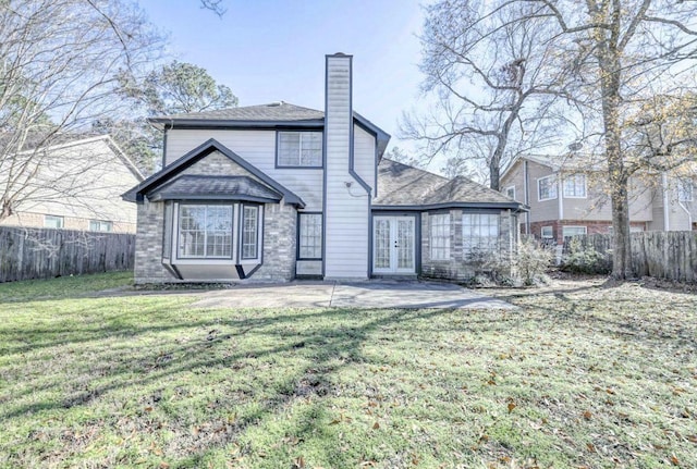 3031 Creek Manor Dr, Houston, TX 77339 - back of property with french doors, a chimney, and a patio area