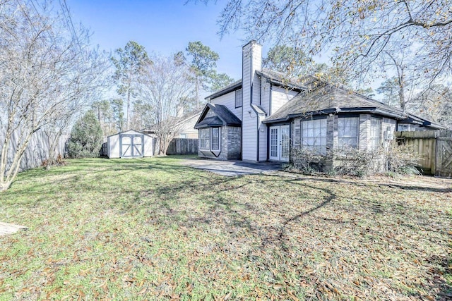 3031 Creek Manor Dr, Houston, TX 77339 - back of property with a chimney, a patio area, and french doors