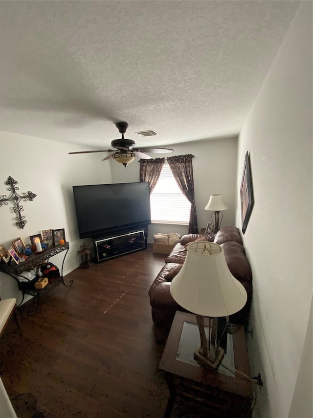7706 Cloverlake Ct, Houston, TX 77040 - living room with wood finished floors, a ceiling fan, and a textured ceiling