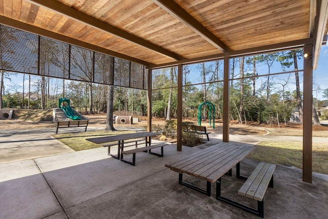 121 N Cadence Hills Loop, Conroe, TX 77318 - view of property's community with a playground and view of scattered trees