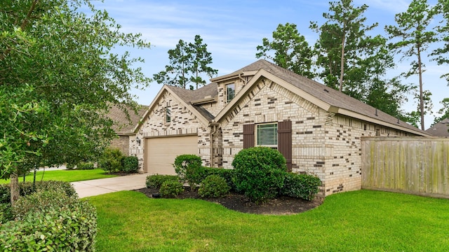 121 N Cadence Hills Loop, Conroe, TX 77318 - french provincial home with brick siding, concrete driveway, a shingled roof, and an attached garage