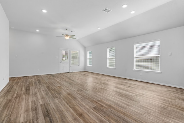 121 N Cadence Hills Loop, Conroe, TX 77318 - unfurnished living room featuring ceiling fan, lofted ceiling, wood finished floors, and recessed lighting