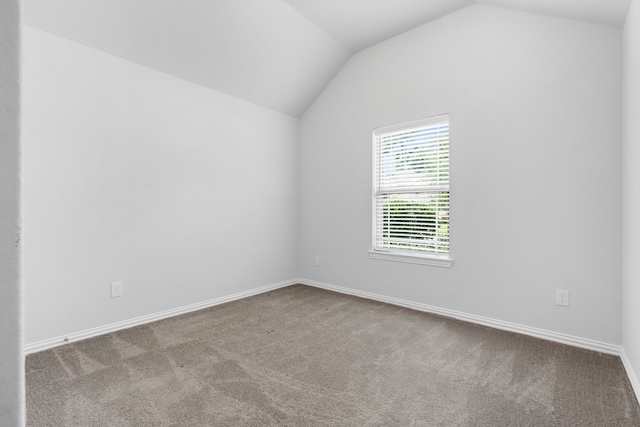 121 N Cadence Hills Loop, Conroe, TX 77318 - empty room with vaulted ceiling and carpet