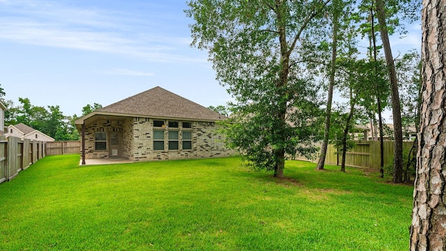 121 N Cadence Hills Loop, Conroe, TX 77318 - fenced backyard featuring a patio
