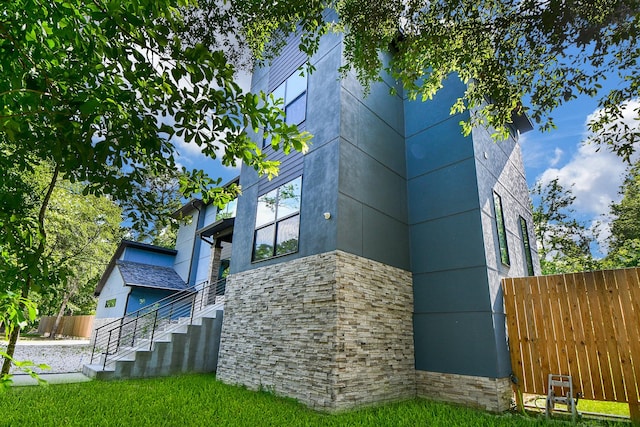 11007 Olde Mint House Ln, Tomball, TX 77375 - view of home's exterior with stone siding