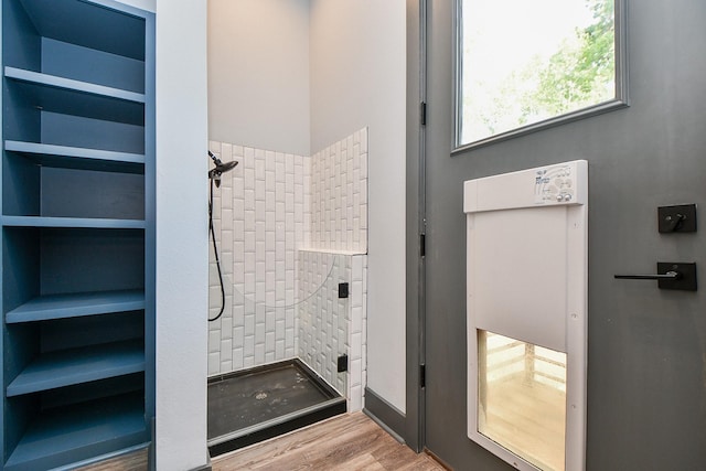 11007 Olde Mint House Ln, Tomball, TX 77375 - bathroom with a shower stall and wood finished floors