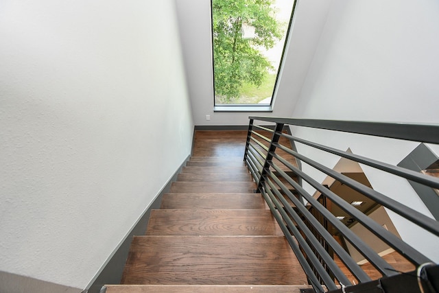 11007 Olde Mint House Ln, Tomball, TX 77375 - staircase featuring wood finished floors and baseboards