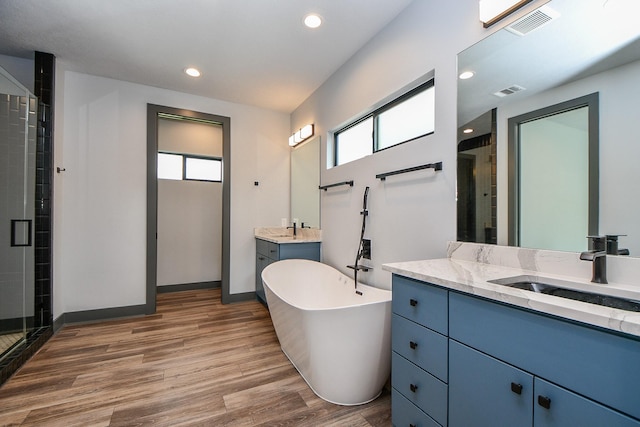 11007 Olde Mint House Ln, Tomball, TX 77375 - full bath with a shower stall, wood finished floors, plenty of natural light, and recessed lighting
