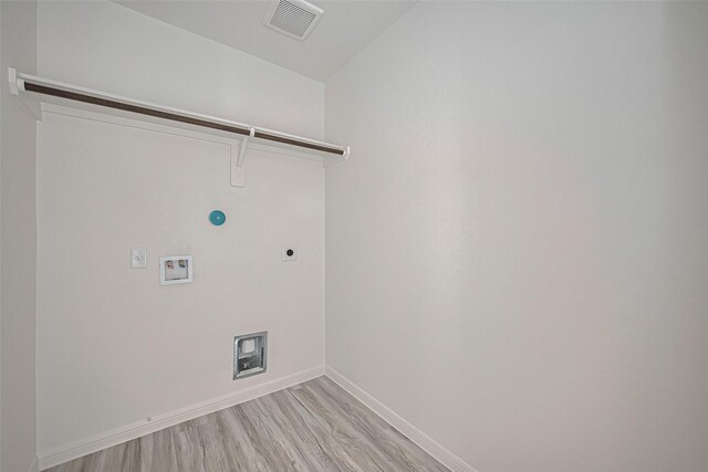 27227 Blue Pool Dr, Katy, TX 77493 - laundry room featuring baseboards, light wood-style flooring, washer hookup, electric dryer hookup, and hookup for a gas dryer