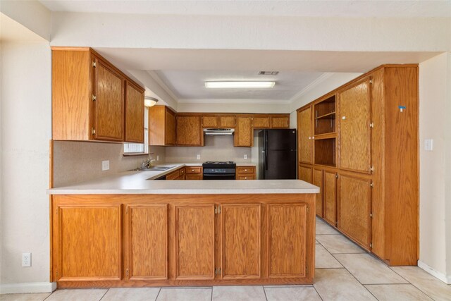 4934 Lamonte Ln, Houston, TX 77092 - kitchen featuring freestanding refrigerator, gas stove, exhaust hood, light countertops, and crown molding