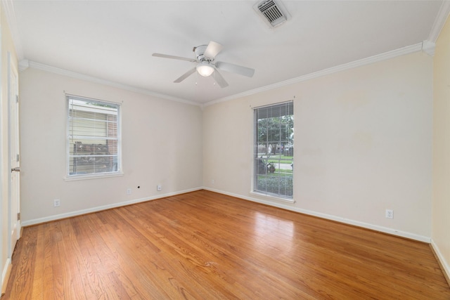 4934 Lamonte Ln, Houston, TX 77092 - empty room featuring crown molding, light wood-style floors, baseboards, and a ceiling fan