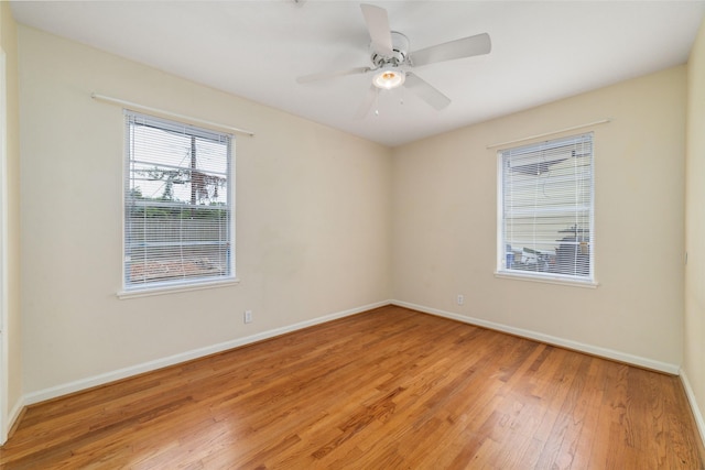 4934 Lamonte Ln, Houston, TX 77092 - empty room featuring light wood-style flooring, baseboards, and ceiling fan