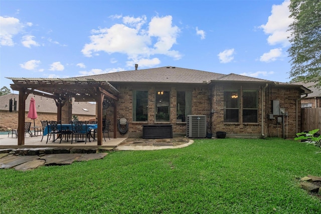 2428 Village Grn, Conroe, TX 77304 - back of property with central AC unit, a pergola, a patio area, and brick siding