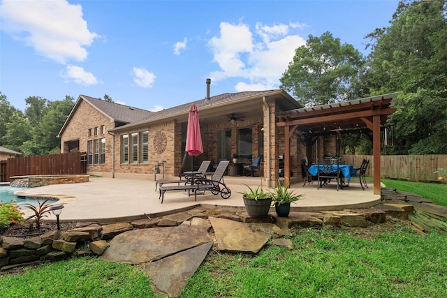 2428 Village Grn, Conroe, TX 77304 - back of house with ceiling fan, brick siding, a fenced backyard, and a patio area