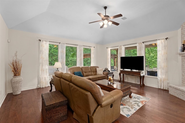2428 Village Grn, Conroe, TX 77304 - living room featuring lofted ceiling, ceiling fan, plenty of natural light, dark wood-style floors, and a fireplace