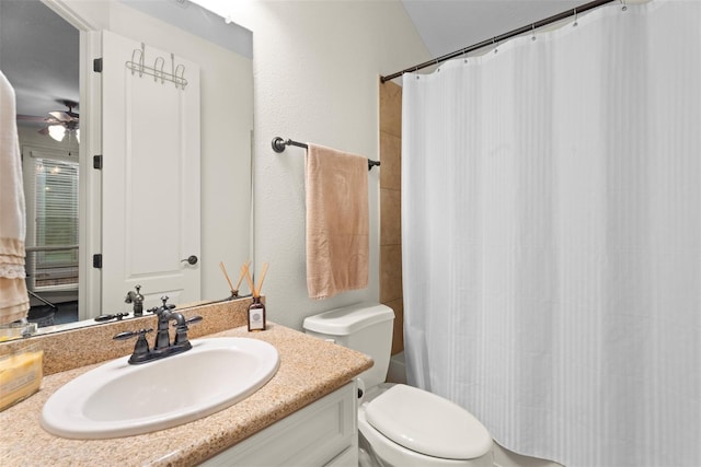 2428 Village Grn, Conroe, TX 77304 - bathroom featuring vanity, toilet, and a ceiling fan