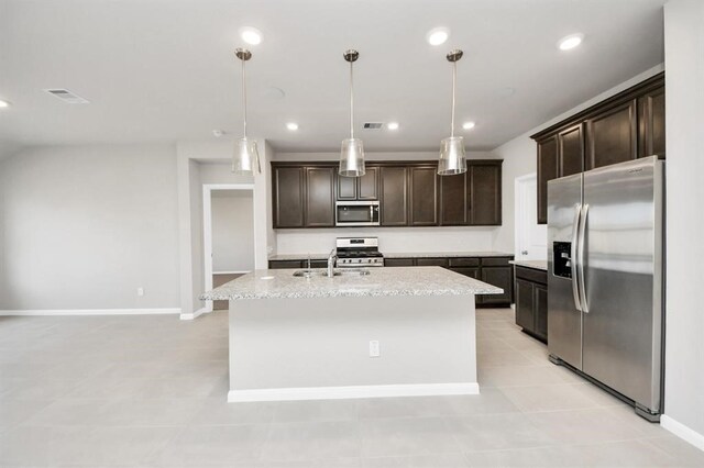 1307 Bonnerjee Dr, Crosby, TX 77532 - kitchen featuring appliances with stainless steel finishes, dark brown cabinets, a sink, a center island with sink, and recessed lighting