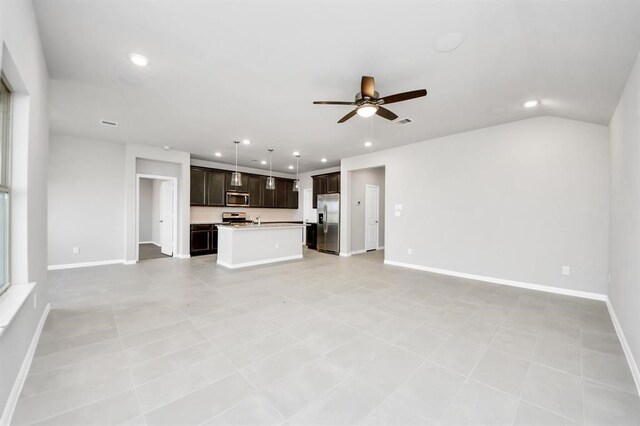 1307 Bonnerjee Dr, Crosby, TX 77532 - unfurnished living room with ceiling fan, recessed lighting, and baseboards