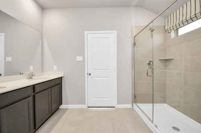 1307 Bonnerjee Dr, Crosby, TX 77532 - full bathroom with tile patterned flooring, a shower stall, double vanity, and baseboards