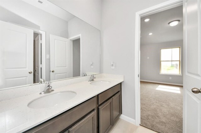 1307 Bonnerjee Dr, Crosby, TX 77532 - bathroom with double vanity and baseboards