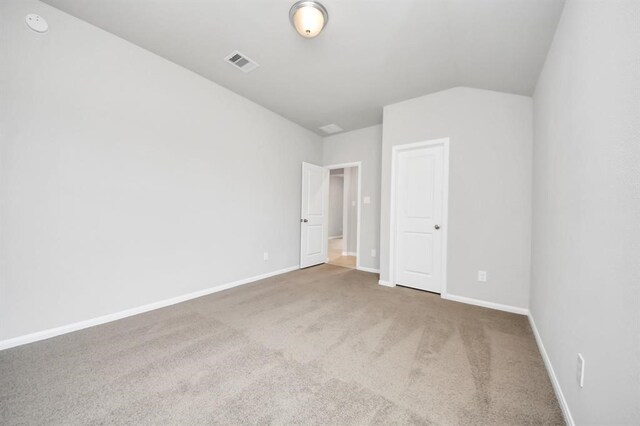 1307 Bonnerjee Dr, Crosby, TX 77532 - unfurnished bedroom featuring carpet, baseboards, and lofted ceiling