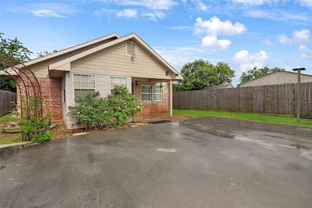 622 19th St, Hempstead, TX 77445 - view of front of home featuring brick siding and a patio area