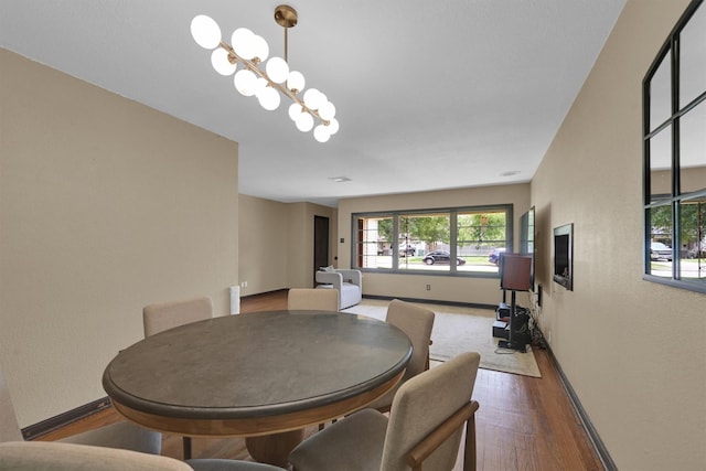 2009 Lamar Dr, Pasadena, TX 77502 - dining room with baseboards, plenty of natural light, wood finished floors, and a textured wall