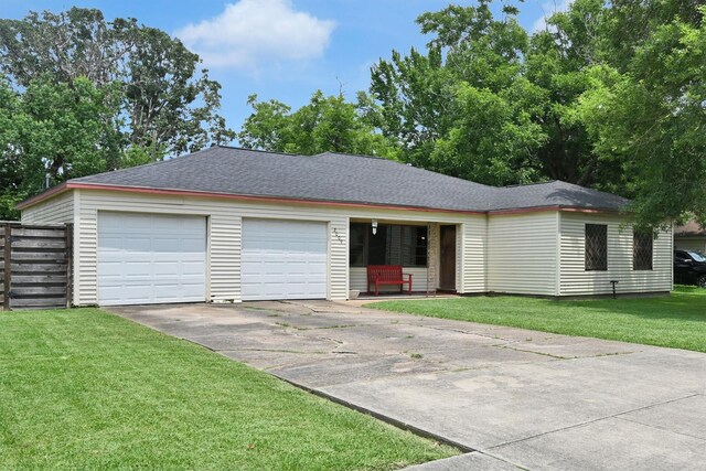 2009 Lamar Dr, Pasadena, TX 77502 - ranch-style home with driveway, a garage, a front lawn, and roof with shingles