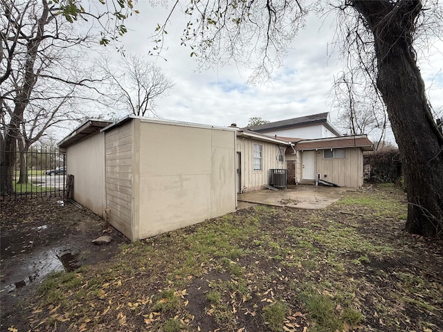 773 Lucky St, Houston, TX 77088 - rear view of house with cooling unit and a patio