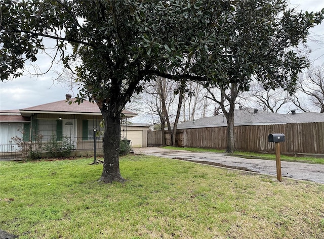 773 Lucky St, Houston, TX 77088 - view of yard with driveway and a garage