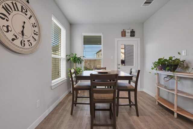 308 Spruce Oak Ln, Waller, TX 77484 - dining space with wood finished floors and baseboards