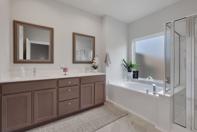 308 Spruce Oak Ln, Waller, TX 77484 - full bathroom featuring a stall shower, marble look tiles, a garden tub, and double vanity