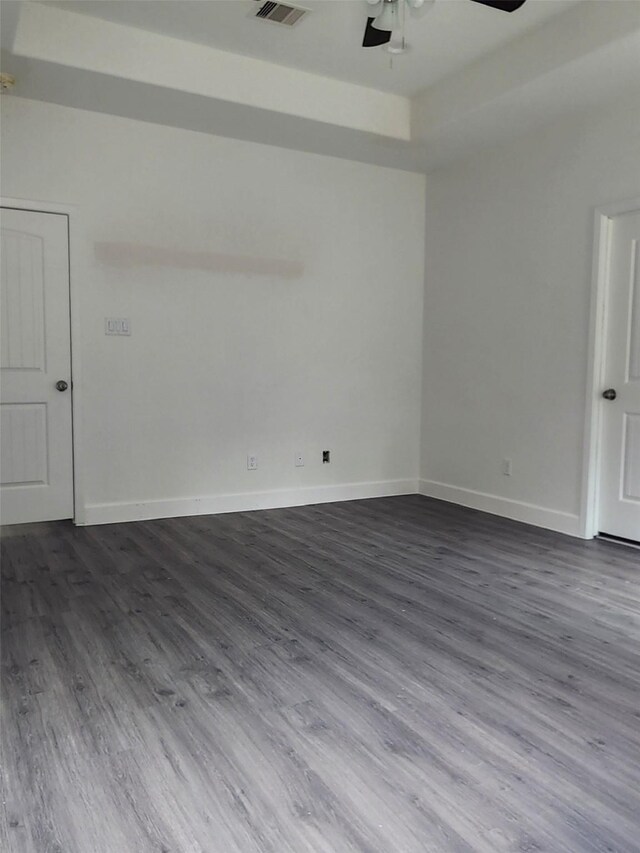 336 Autumn Ln, Livingston, TX 77351 - unfurnished room featuring a ceiling fan, dark wood-style flooring, and baseboards