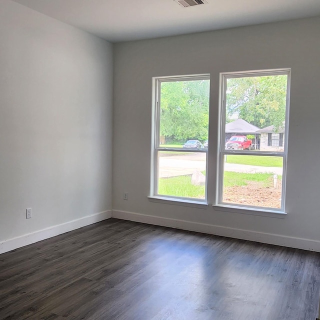 336 Autumn Ln, Livingston, TX 77351 - empty room with baseboards and dark wood-type flooring