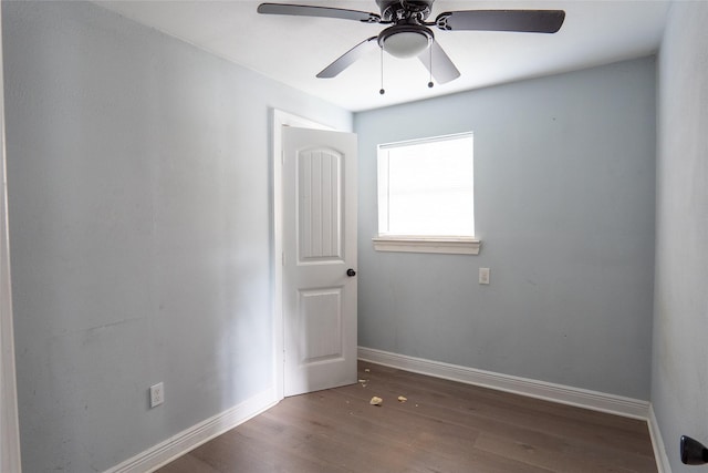 202 Booker T Washington St, Conroe, TX 77301 - empty room featuring wood finished floors, baseboards, and ceiling fan