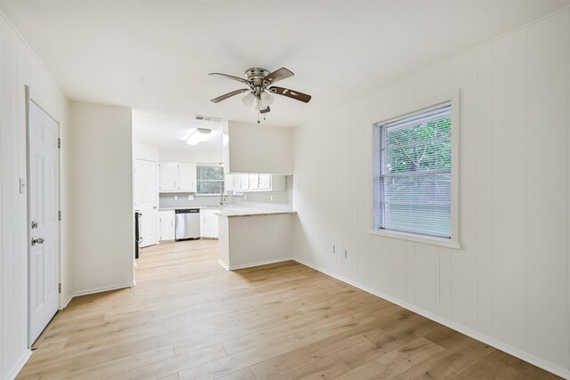 100 Harold Ln, Baytown, TX 77521 - unfurnished living room with light wood-style flooring, ceiling fan, and a sink