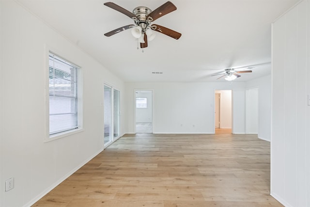 100 Harold Ln, Baytown, TX 77521 - unfurnished room featuring a ceiling fan, healthy amount of natural light, and light wood-style floors