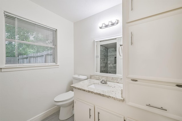 100 Harold Ln, Baytown, TX 77521 - bathroom featuring vanity, toilet, and baseboards