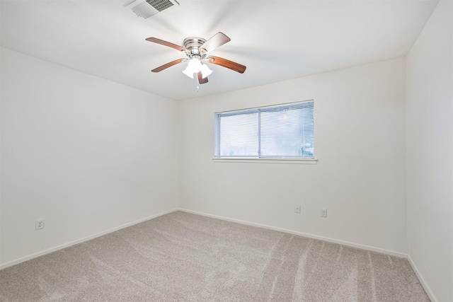 100 Harold Ln, Baytown, TX 77521 - spare room featuring light carpet, ceiling fan, and baseboards