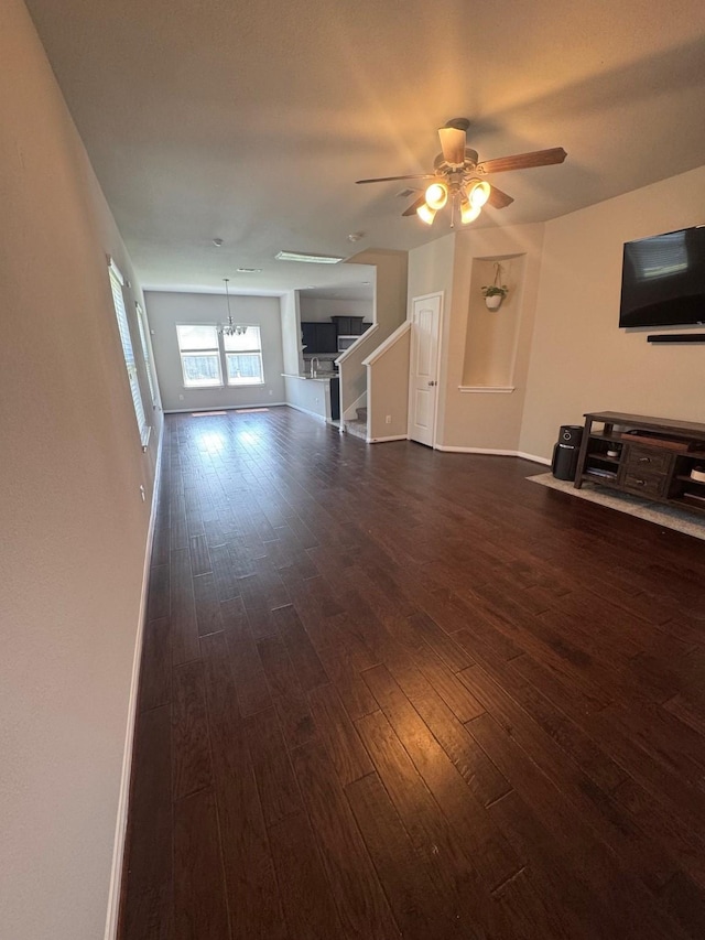 1938 Acaciawood Way, Houston, TX 77051 - unfurnished living room with dark wood-type flooring, ceiling fan, stairway, and baseboards