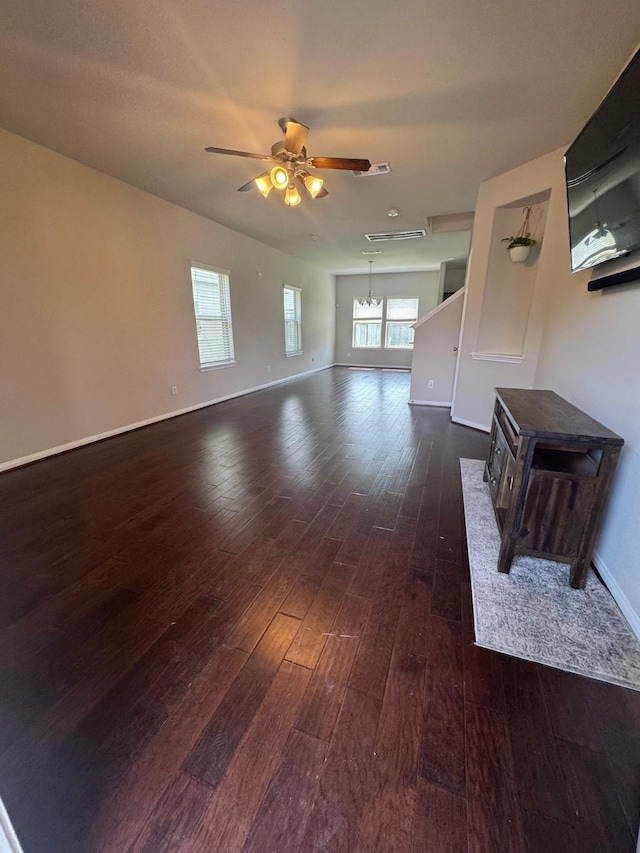 1938 Acaciawood Way, Houston, TX 77051 - unfurnished living room featuring dark wood-style floors, ceiling fan, and baseboards