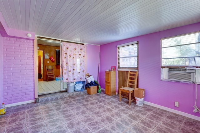 2630 Tidewater Dr, Houston, TX 77045 - spare room featuring baseboards, cooling unit, and wooden ceiling