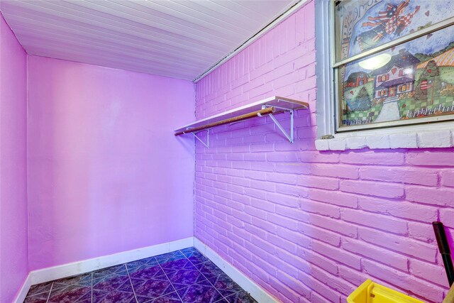 2630 Tidewater Dr, Houston, TX 77045 - interior space featuring baseboards and brick wall