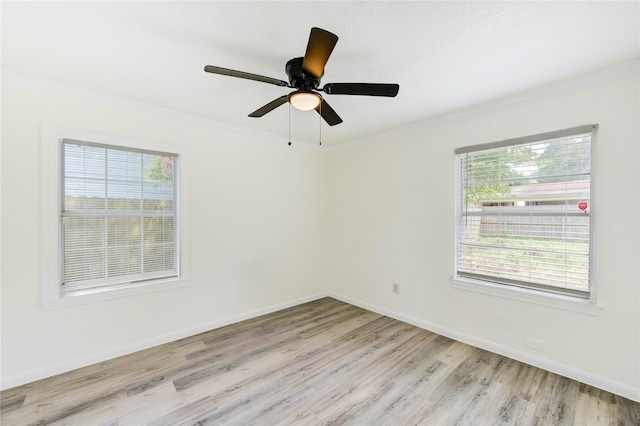 5326 Keystone St, Houston, TX 77021 - unfurnished room featuring ornamental molding, light wood-style floors, baseboards, and ceiling fan