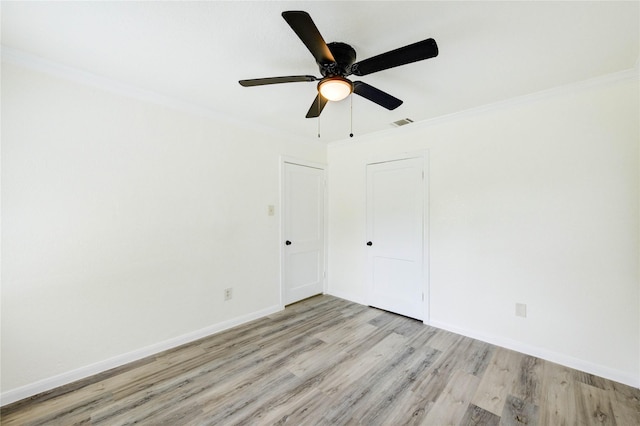 5326 Keystone St, Houston, TX 77021 - unfurnished room with light wood finished floors, ornamental molding, baseboards, and ceiling fan